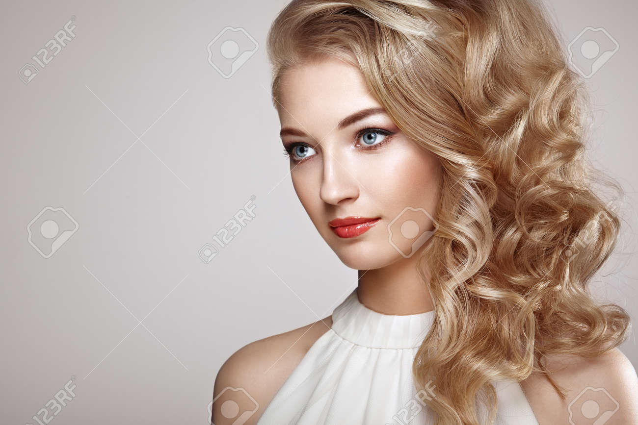 Fashion portrait of young beautiful woman with jewelry and elegant hairstyle. Blonde girl with long wavy hair. Perfect make-up. Beauty style woman with diamond accessories - 63881677 Fashion portrait of young beautiful woman with jewelry and elegant hairstyle. Blonde girl with long wavy hair. Perfect make-up. Beauty style woman with diamond accessories - 63881677