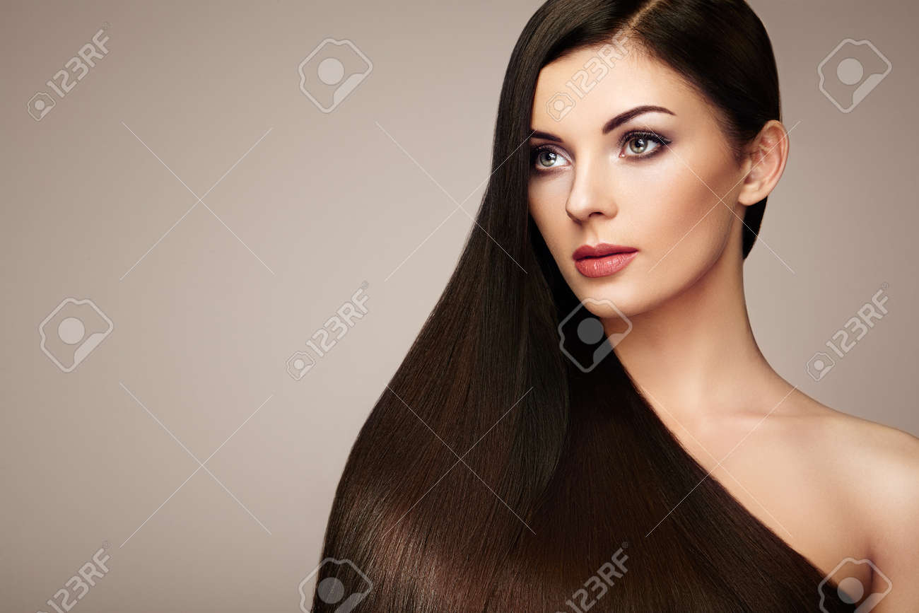 Beautiful woman with long smooth hair. Girl with perfect makeup and hairstyle. Model brunette with perfect healthy dark hair - 75527797 Beautiful woman with long smooth hair. Girl with perfect makeup and hairstyle. Model brunette with perfect healthy dark hair - 75527797