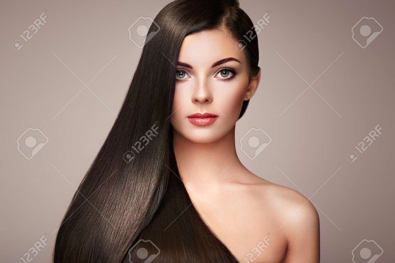 Beautiful woman with long smooth hair. Girl with perfect makeup and hairstyle. Model brunette with perfect healthy dark hair - 75527870 Beautiful woman with long smooth hair. Girl with perfect makeup and hairstyle. Model brunette with perfect healthy dark hair - 75527870