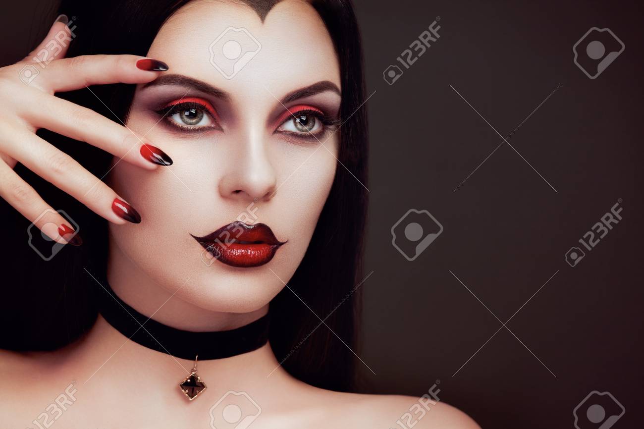 Halloween Vampire Woman Portrait. Beautiful Glamour Fashion Sexy Vampire  Lady With Long Dark Hair, Beauty Make Up And Costume Stock Photo, Picture  And Royalty Free Image. Image 88453049.