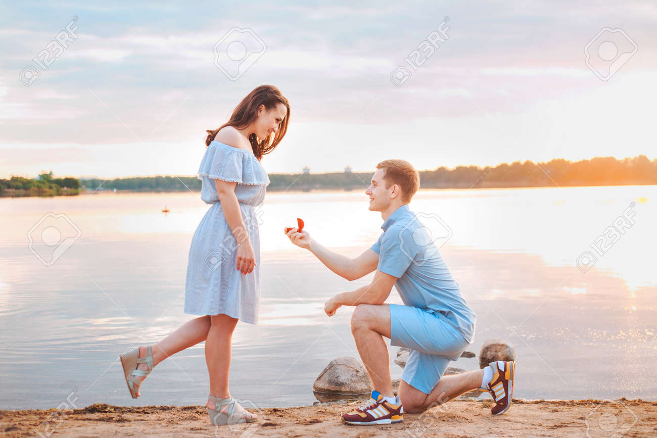 marriage proposal on sunset young man makes a proposal of
