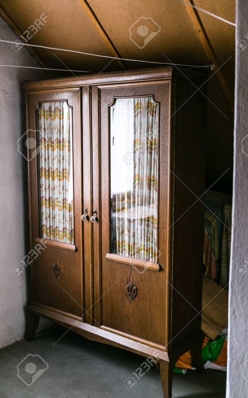 Very Old Antique Wardrobe Furniture In The Loft Stock Photo, Picture Stock Photo - very old antique wardrobe furniture in the loft - Very Old Antique Wardrobe Furniture In The Loft Stock Photo, Picture