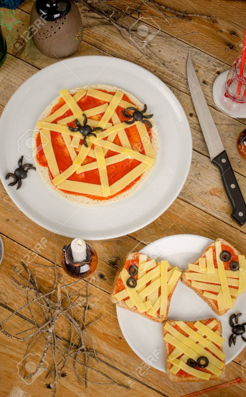spooky halloween snacks set up on a wooden table stock photo 31406920