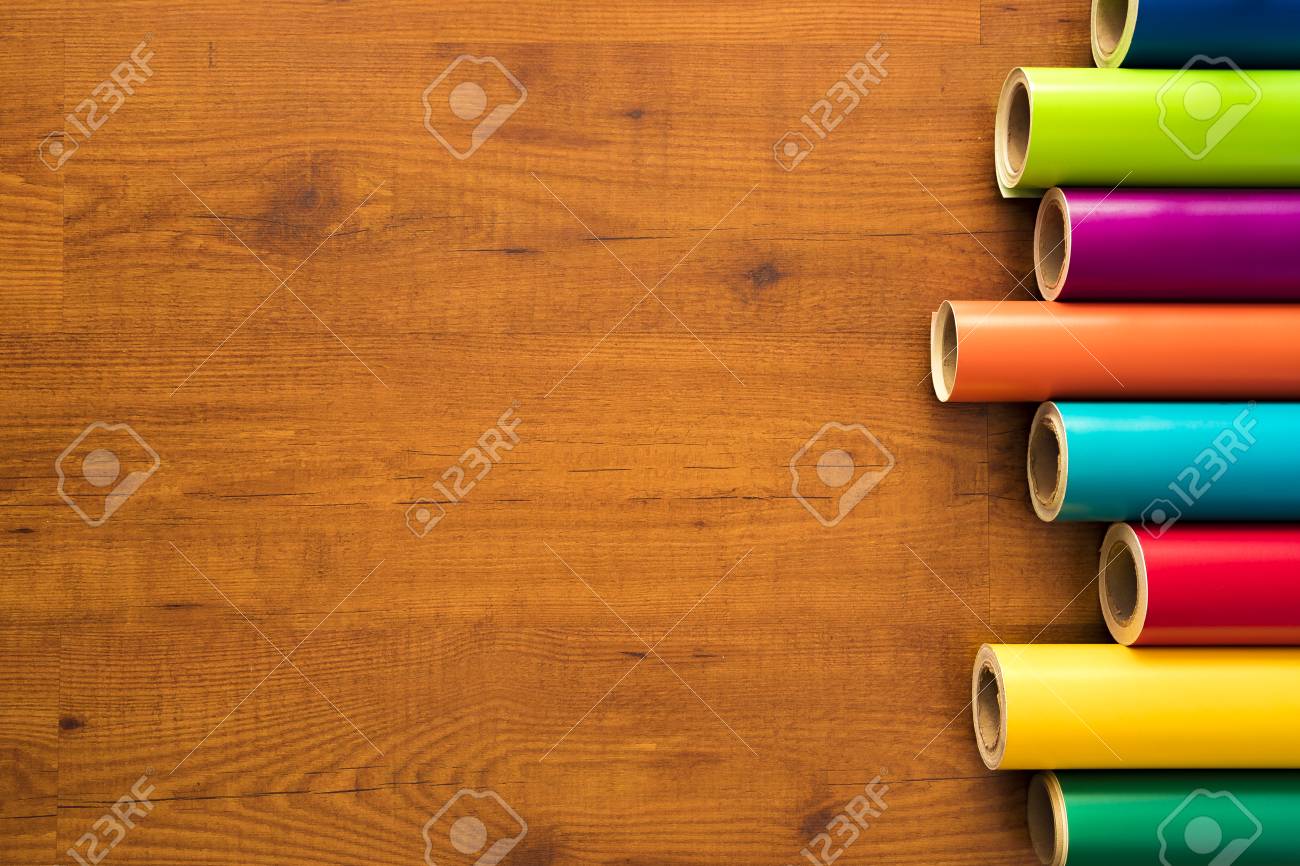 Colored Vinyl Rolls Over Wooden Background Stock Photo Picture