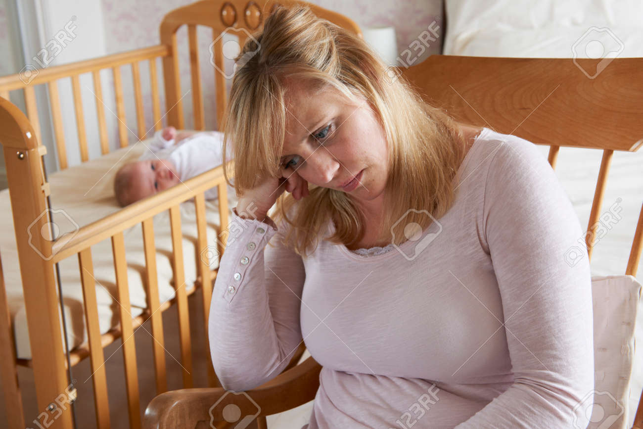 Mother In Nursery Suffering From Post Natal Depression - 50160074 Mother In Nursery Suffering From Post Natal Depression - 50160074