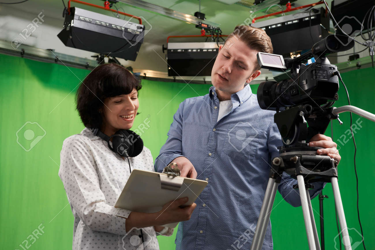 Cameraman And Floor Manager In Television Studio Stock Photo