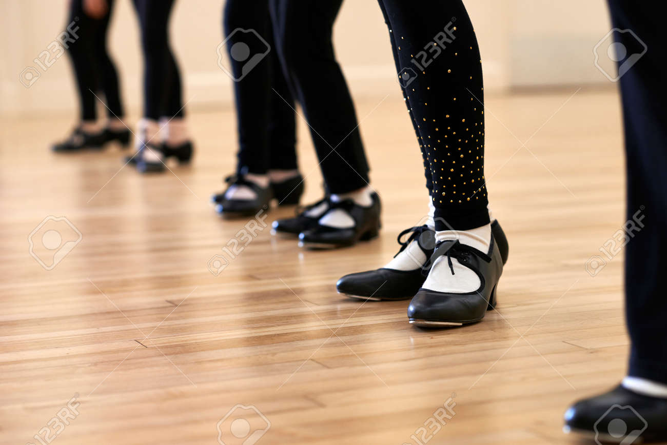 Close Up Of Feet In Children's Tap Dancing Class - 56216399 Close Up Of Feet In Children's Tap Dancing Class - 56216399
