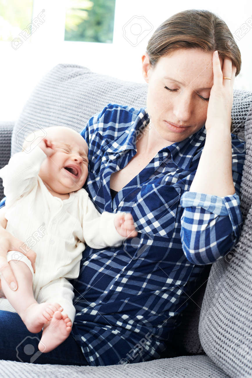 Frustrated Mother Suffering From Post Natal Depression - 64168748 Frustrated Mother Suffering From Post Natal Depression - 64168748