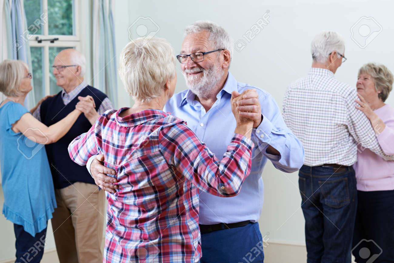 Group Of Seniors Enjoying Dancing Club Together - 64168234 Group Of Seniors Enjoying Dancing Club Together - 64168234