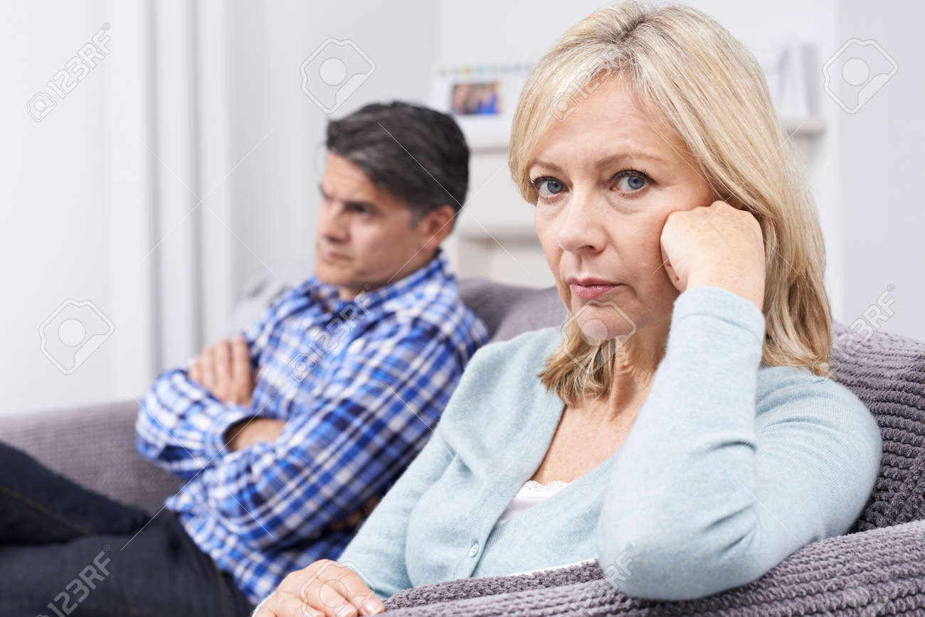 Mature Couple With Relationship Difficulties Sitting On Sofa - 65715862 Mature Couple With Relationship Difficulties Sitting On Sofa - 65715862