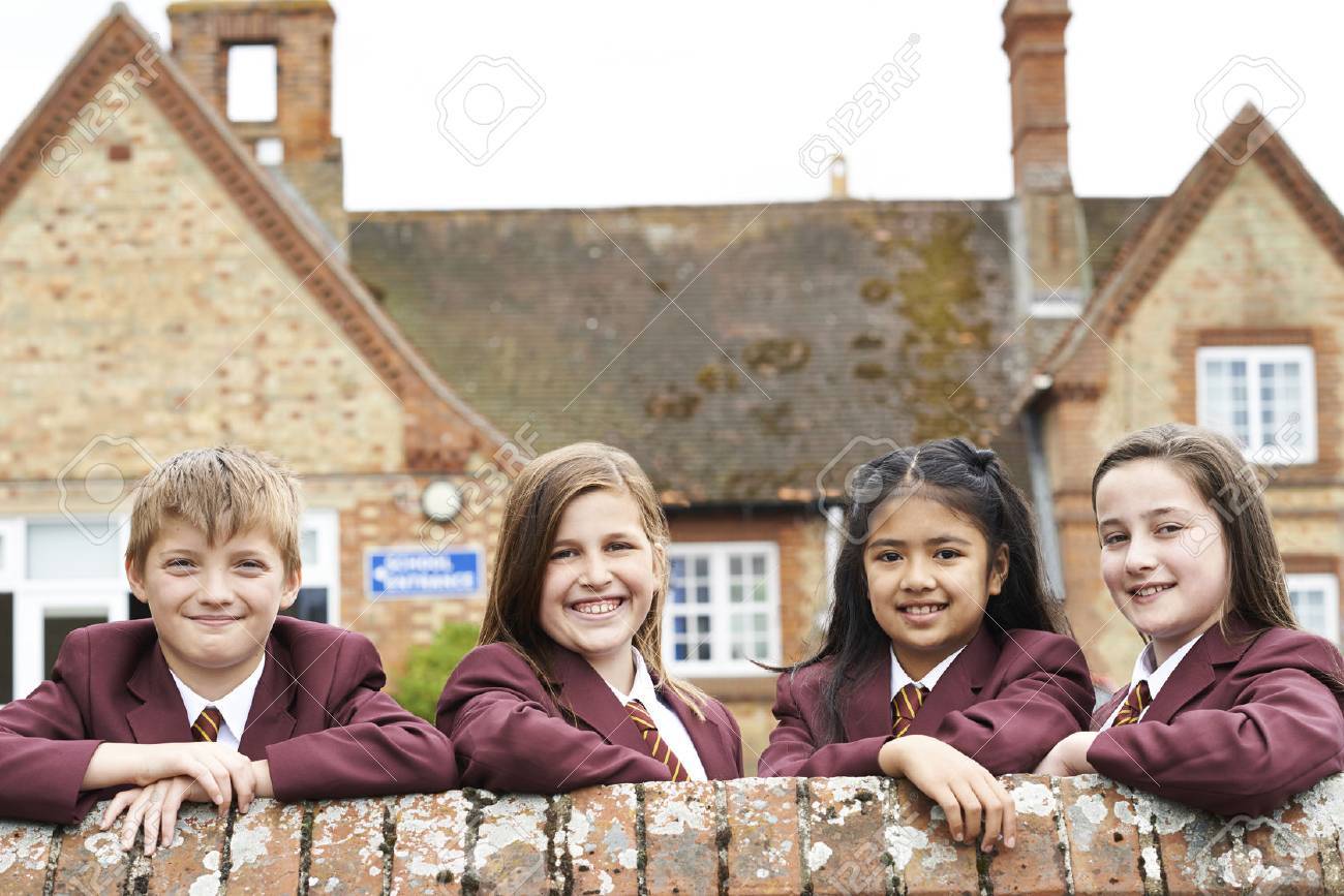 Portrait Of Pupils In Uniform Outside School Building - 63034793 Portrait Of Pupils In Uniform Outside School Building - 63034793