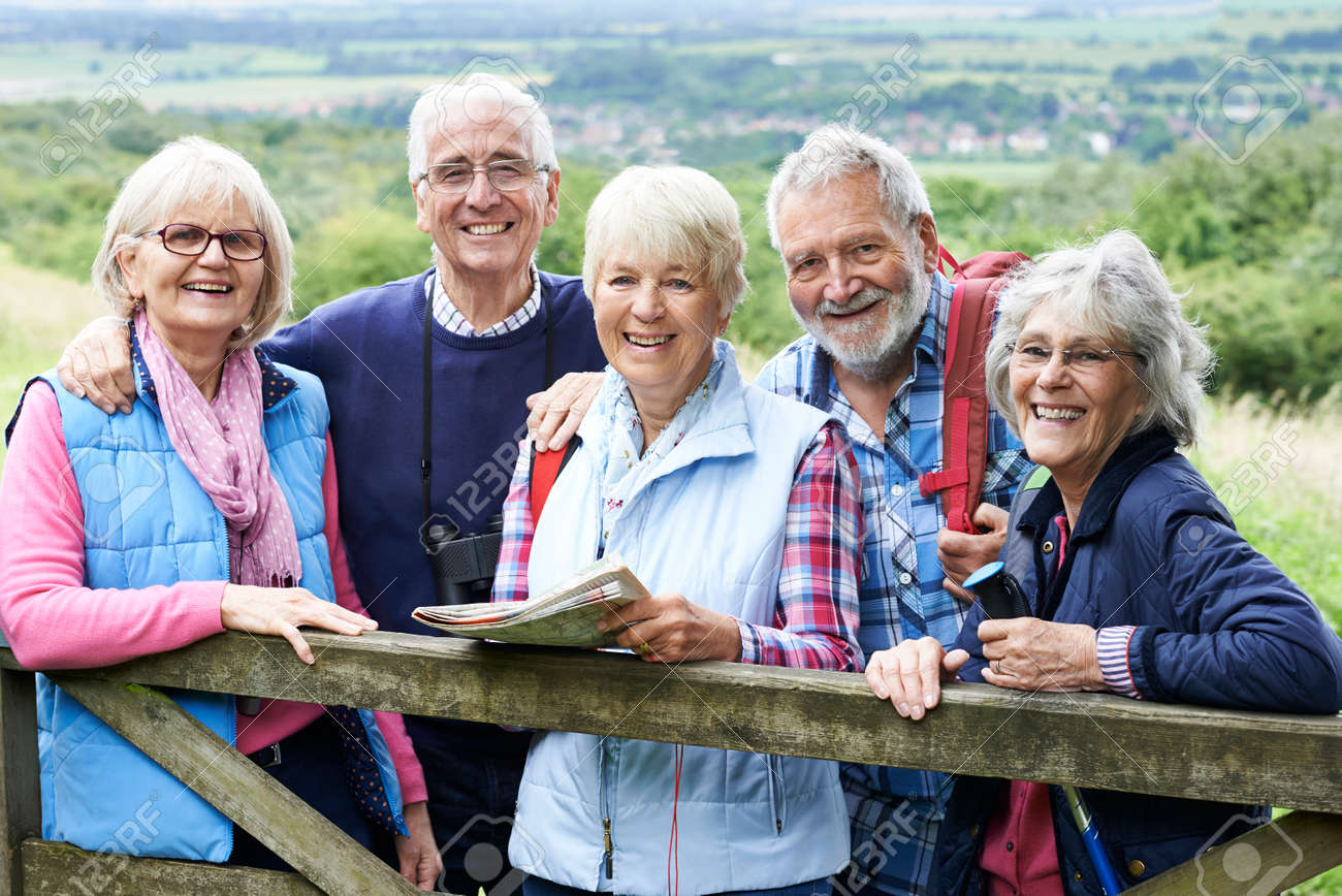 Group Of Senior Friends Hiking In Countryside - 65619247 Group Of Senior Friends Hiking In Countryside - 65619247