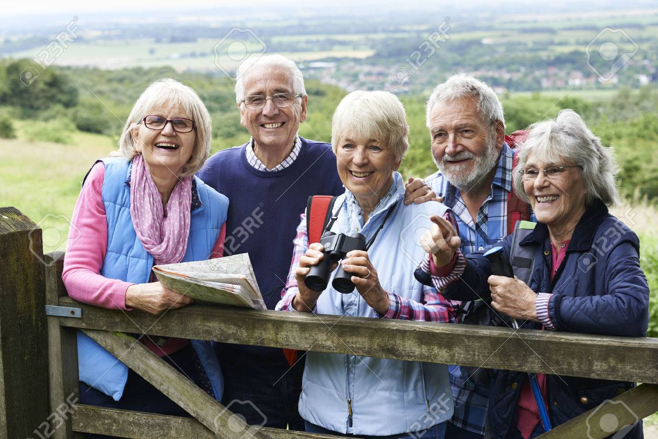 Group Of Senior Friends Hiking In Countryside - 65620549 Group Of Senior Friends Hiking In Countryside - 65620549