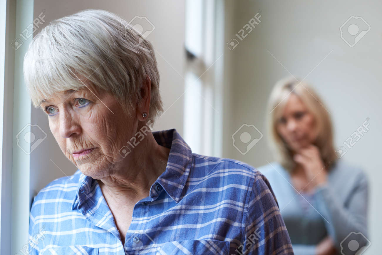 Serious Senior Woman With Adult Daughter At Home - 71627940 Serious Senior Woman With Adult Daughter At Home - 71627940