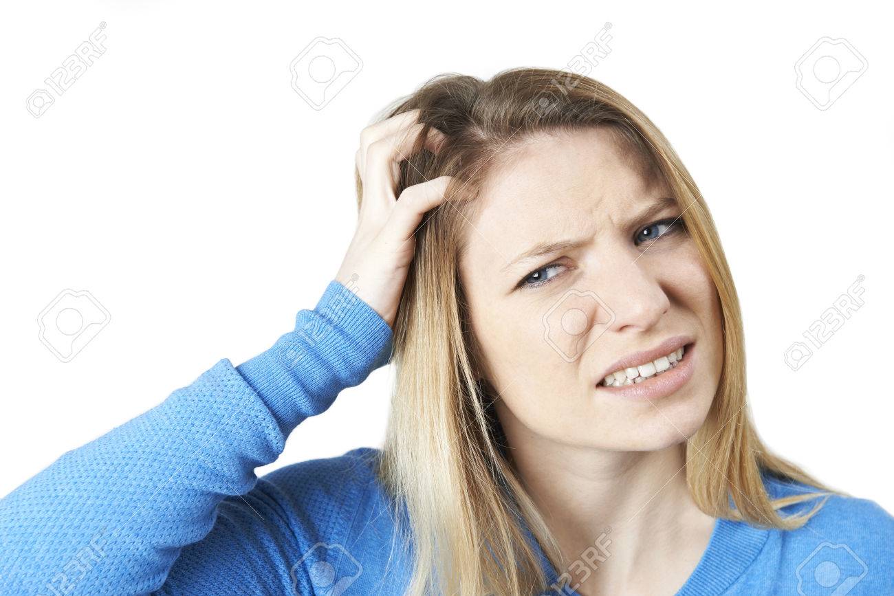 Studio Shot Of Young Woman Itching Scalp - 73172421 Studio Shot Of Young Woman Itching Scalp - 73172421