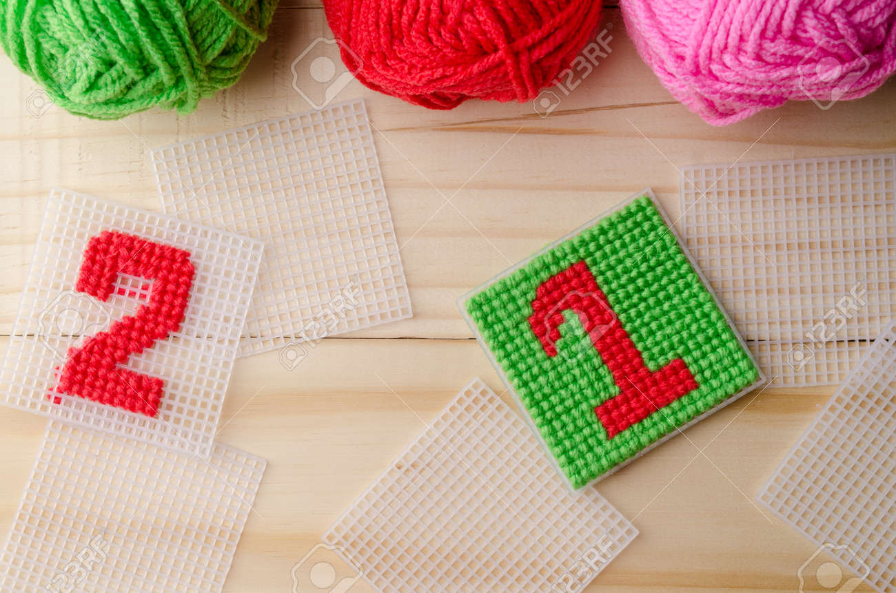 Plastic Canvas, Hand Made With Red Yarn Number On Wooden Background. Stock  Photo, Picture And Royalty Free Image. Image 65273409.