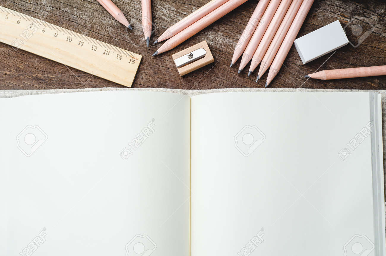 Blank everyday planner laptop with pencils, pencil sharpener,.. photograph relating to Daily Planner Notebook called Blank every day planner laptop computer with pencils, pencil sharpener,..