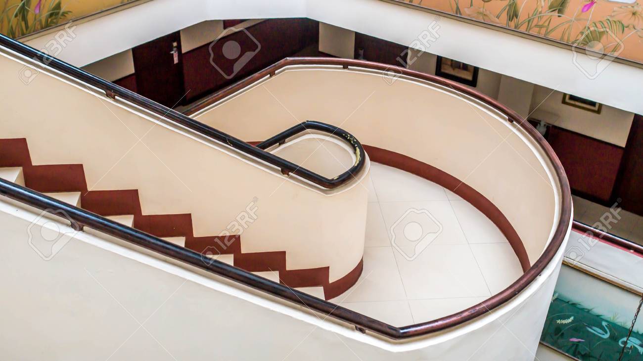 spiral concrete staircase in the middle of the building stock photo