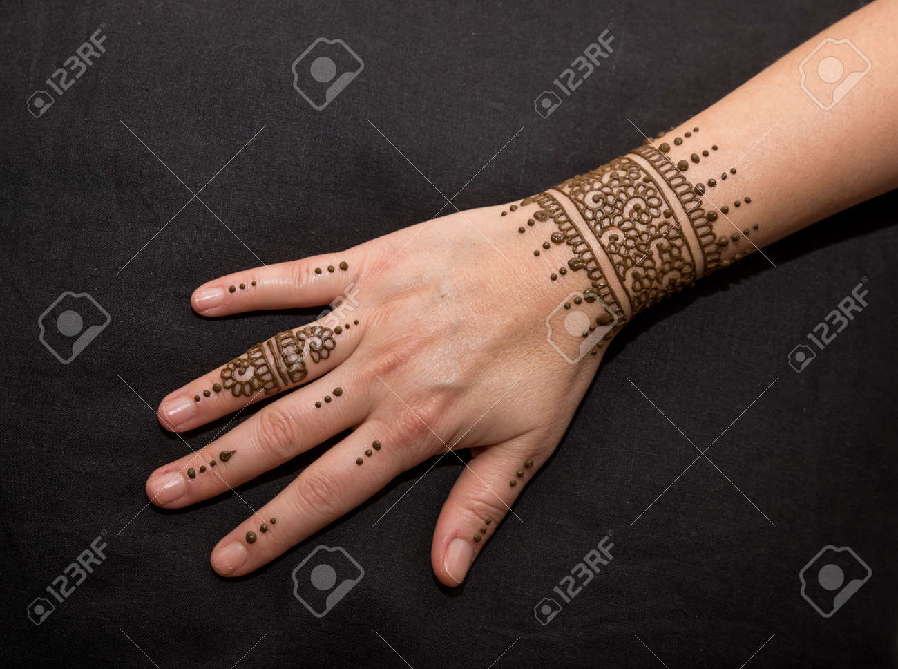 Woman Hand With Black Cute Henna Mehendi Designs Stock Photo, Picture And Royalty Free Image. Image 140635072.