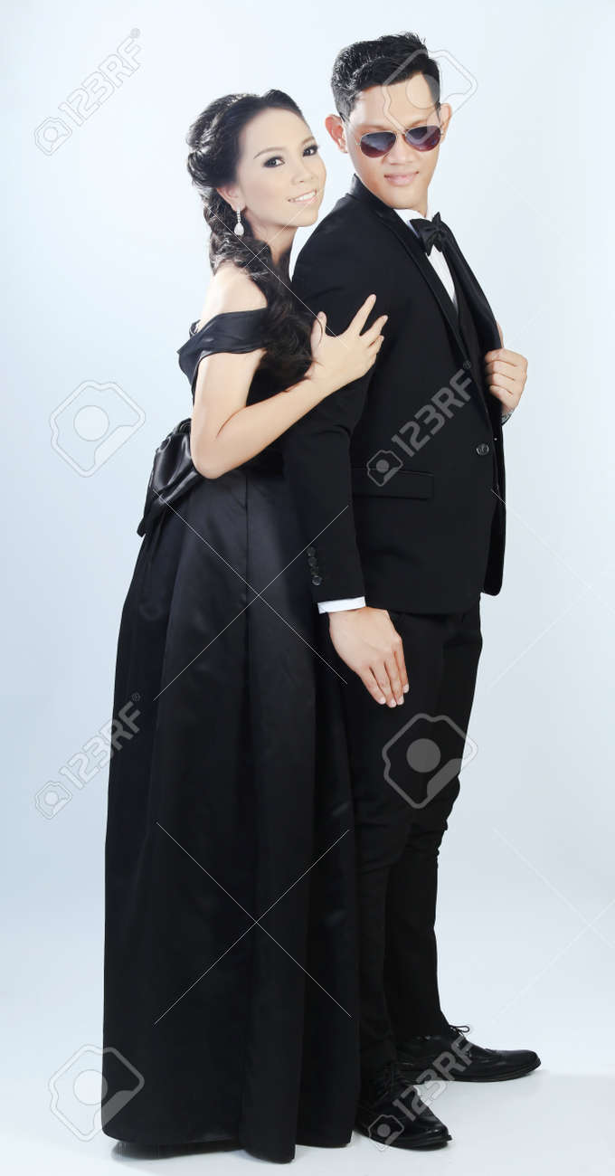 Young Asian Boys And Girl In A Suit In