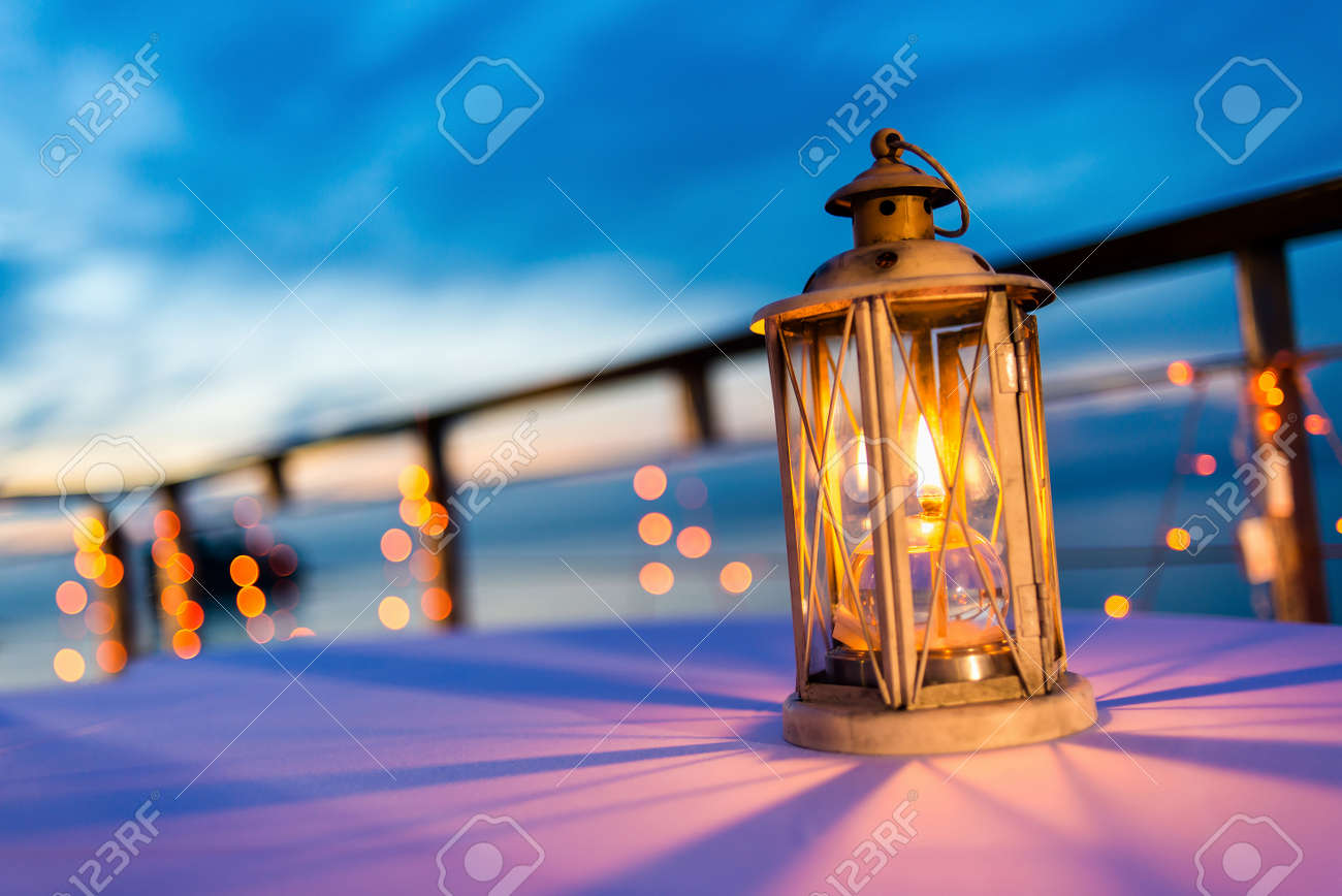 Lantern on table at twilight sky, selective focus. - 47293910 Lantern on table at twilight sky, selective focus. - 47293910