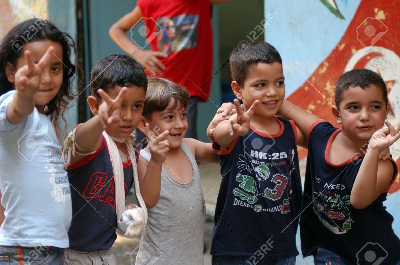 BEIRUT, LEBANON-AUGUST 2:Unidentified Palestinian children make victory sign in Shatila refugee camp on August 2, 2006 in Beirut,Lebanon - 17051050 BEIRUT, LEBANON-AUGUST 2:Unidentified Palestinian children make victory sign in Shatila refugee camp on August 2, 2006 in Beirut,Lebanon - 17051050