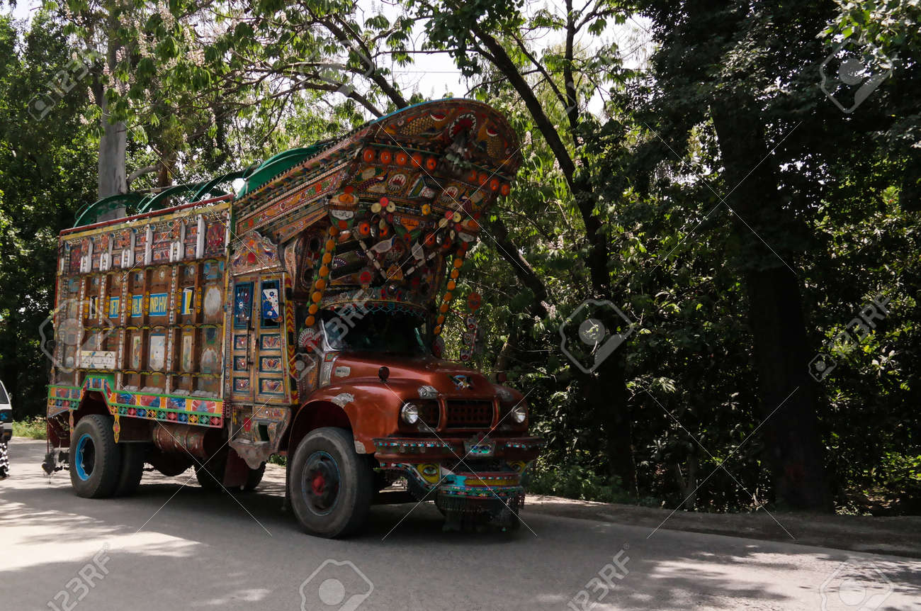 Stock photo of Typical rural transport, overloaded van with people, Maharashtra, India. Available for sale on
