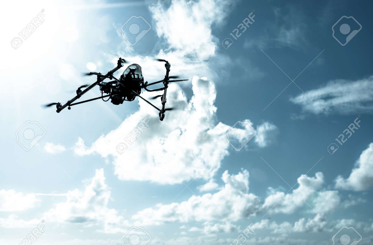 Octarotor drone flying in on a dramatic cloudy sky. - 20015674 Octarotor drone flying in on a dramatic cloudy sky. - 20015674
