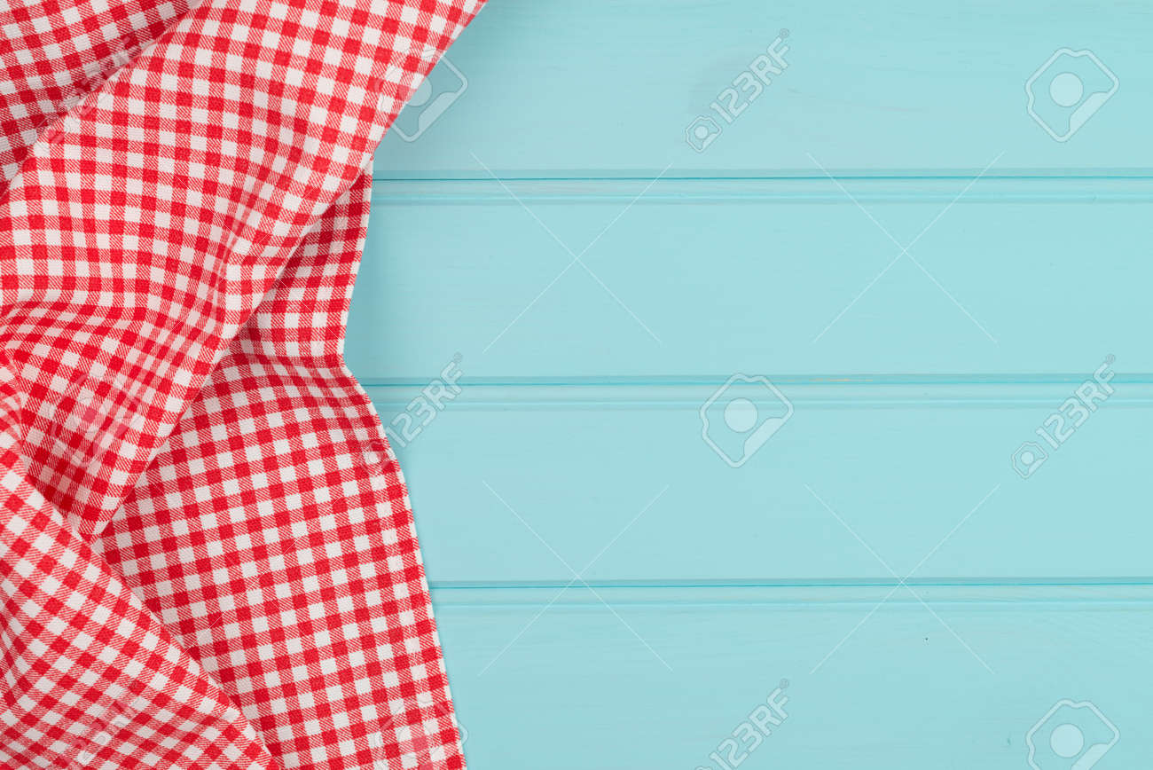White and red towel over wooden kitchen table. View from above. - 39634388 White and red towel over wooden kitchen table. View from above. - 39634388