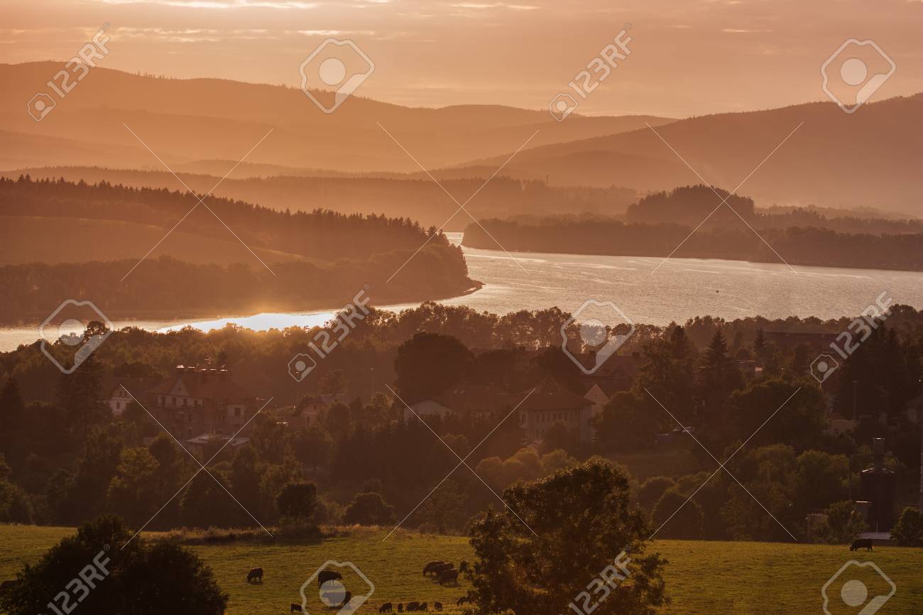 Colorful idyllic evening landscape at lake Lipno, Horni Plana, Czech mountains Sumava, Bohemian forest Bavarian Forest - 104890785 Colorful idyllic evening landscape at lake Lipno, Horni Plana, Czech mountains Sumava, Bohemian forest Bavarian Forest - 104890785