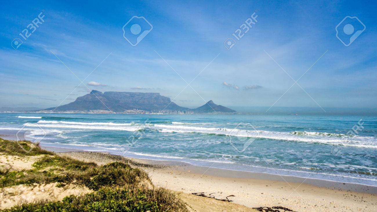 Early morning view of Cape Town and Table Mountain with Lion's Head and Signal Hill on the right and Devil's Peak on the left. Viewed from Bloubergstrand just north of the city - 84397103 Early morning view of Cape Town and Table Mountain with Lion's Head and Signal Hill on the right and Devil's Peak on the left. Viewed from Bloubergstrand just north of the city - 84397103