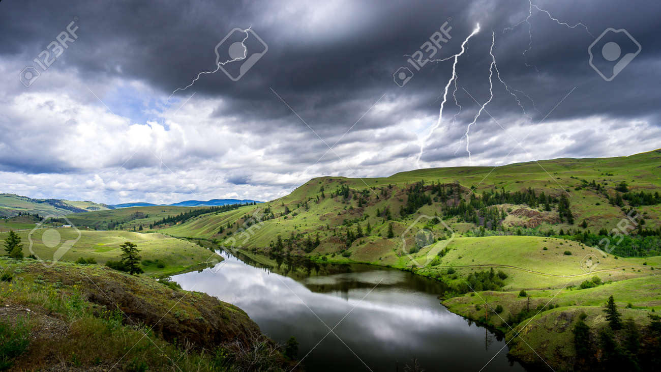 Lightning Strikes from Dark Clouds over Napier Lake in the Grasslands along Highway 5A between Kamloops and Merritt in British Columbia, Canada - 156121220 Lightning Strikes from Dark Clouds over Napier Lake in the Grasslands along Highway 5A between Kamloops and Merritt in British Columbia, Canada - 156121220