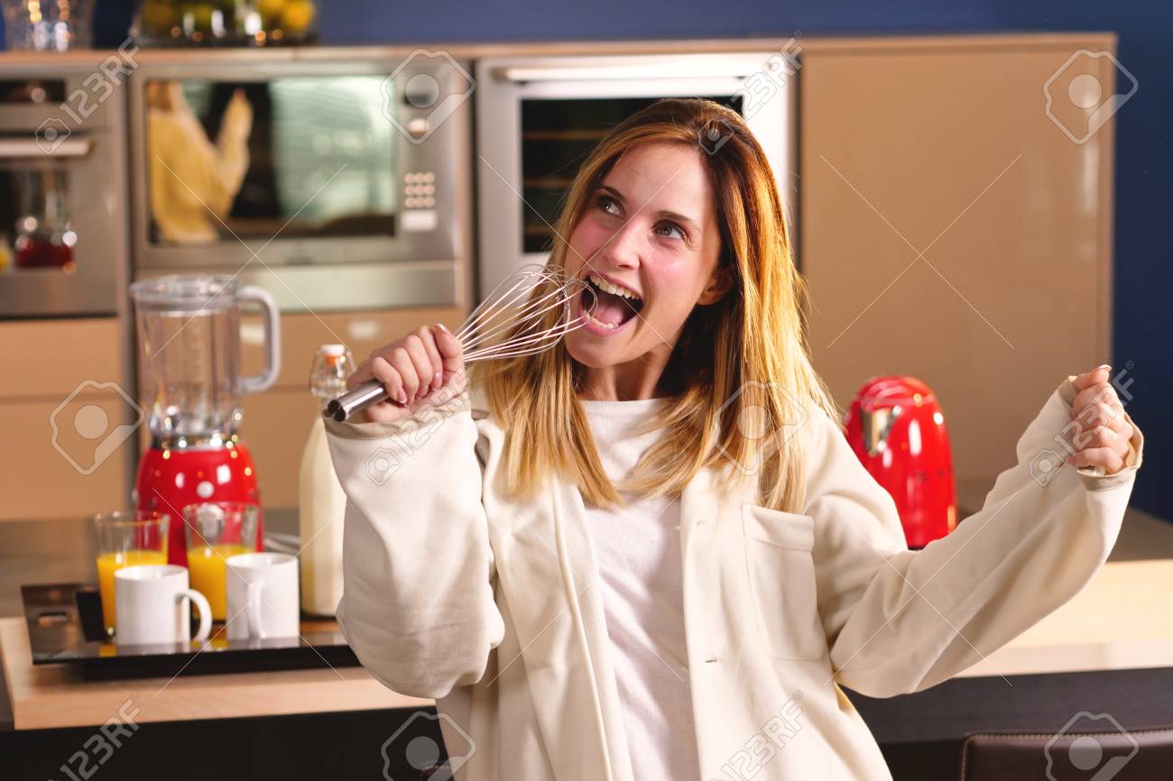 Hand In Mix To Eat Woman In Kitchen In Pajamas Singing Holding Stock Photo Picture And Royalty Free Image Image 113383245