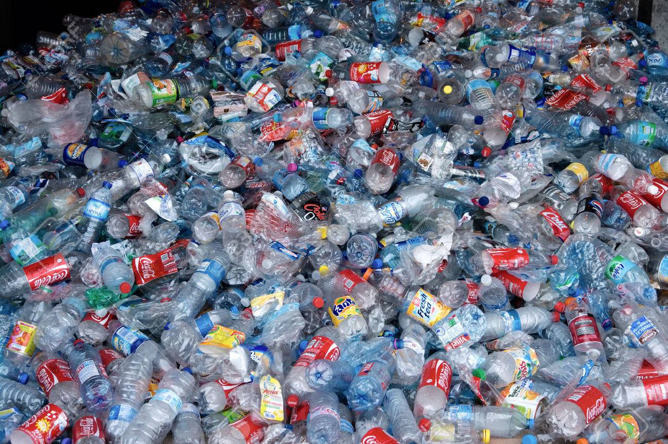 TOULOUSE, FRANCE - CIRCA 2009: Clear plastic bottles lie in a heap at an undisclosed recycling facility circa 2009 in Toulouse. The plastic is gathered by color and type to be recycled. - 24957704 TOULOUSE, FRANCE - CIRCA 2009: Clear plastic bottles lie in a heap at an undisclosed recycling facility circa 2009 in Toulouse. The plastic is gathered by color and type to be recycled. - 24957704