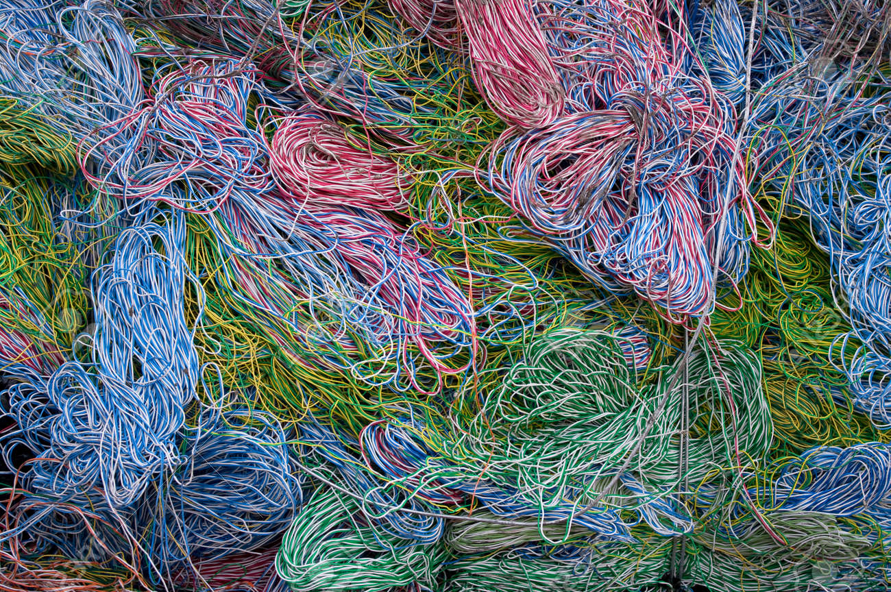 A bale of recycling telephone cables. There is a mix of plastic and copper to recover. - 24960475 A bale of recycling telephone cables. There is a mix of plastic and copper to recover. - 24960475