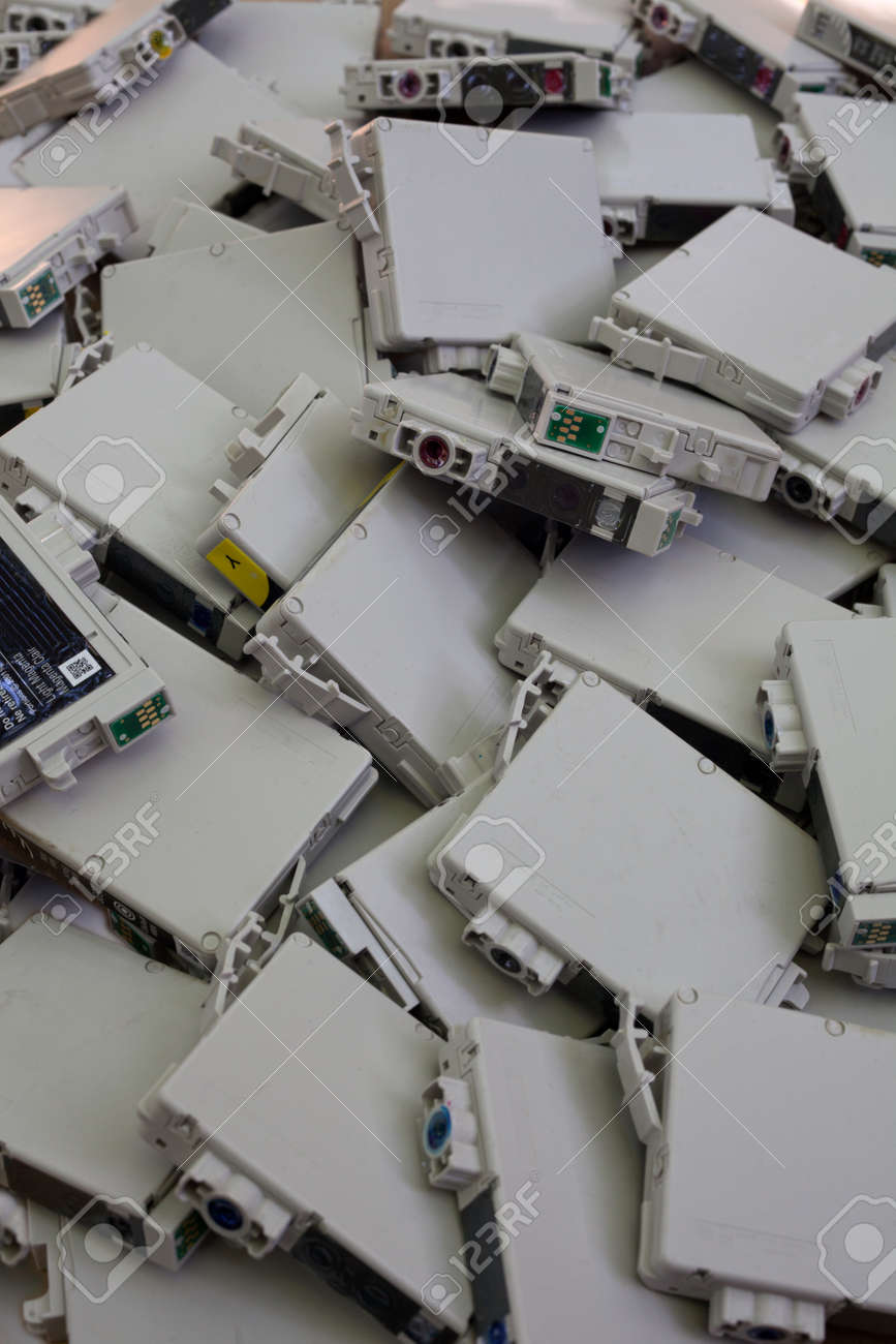 OEM, non-refillable, brand name inkjet printer cartridges lying in a heap - 30323081 OEM, non-refillable, brand name inkjet printer cartridges lying in a heap - 30323081