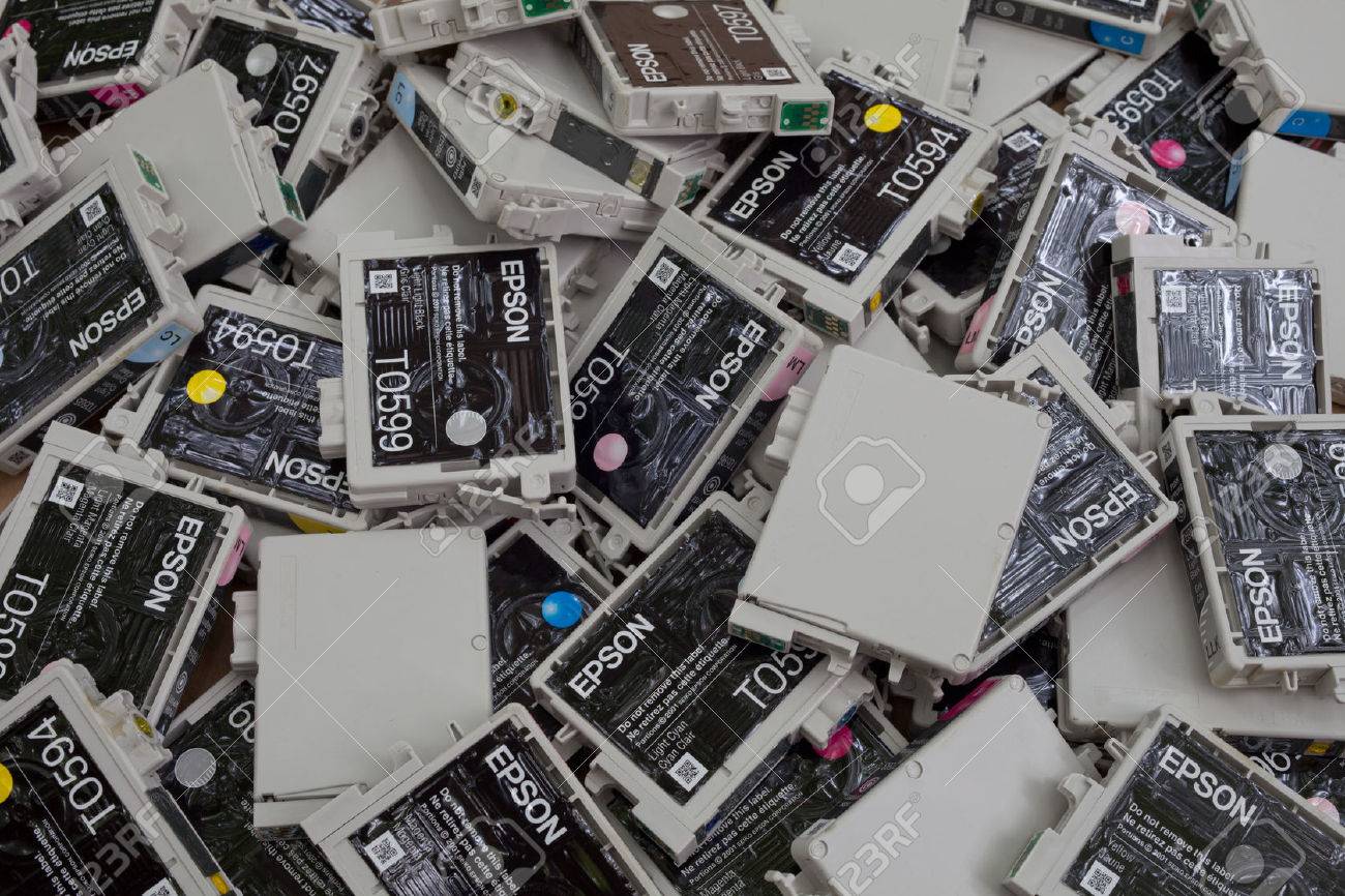 Background of nonrefillable inkjet printer cartridges (Original Equipment Manufacturer: OEM) lying in a heap. Printer manufacturers require their costumers to buy new cartridges rather than offering a refill system that would reduce waste. Due to the twis - 30165064 Background of nonrefillable inkjet printer cartridges (Original Equipment Manufacturer: OEM) lying in a heap. Printer manufacturers require their costumers to buy new cartridges rather than offering a refill system that would reduce waste. Due to the twis - 30165064