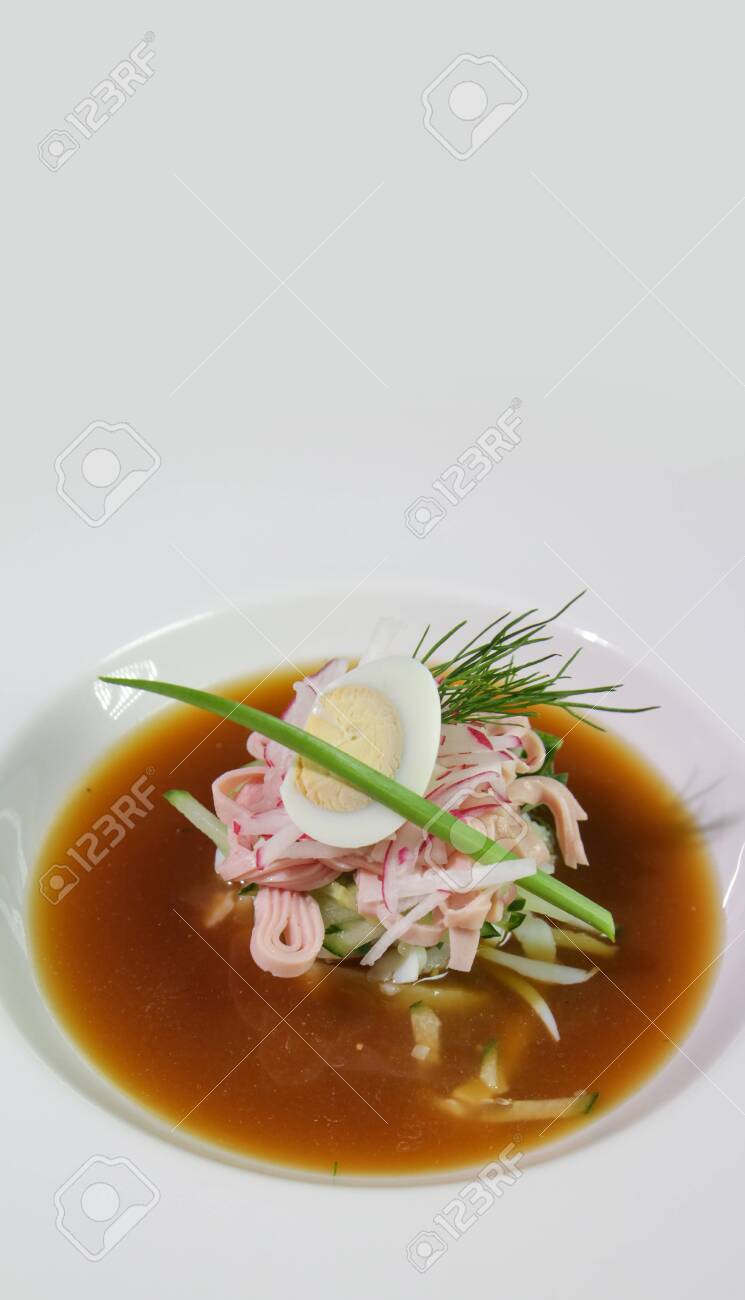 Close-up of Kvass okroshka in a white plate.Vertical composition.Copy space. - 140470579 Close-up of Kvass okroshka in a white plate.Vertical composition.Copy space. - 140470579