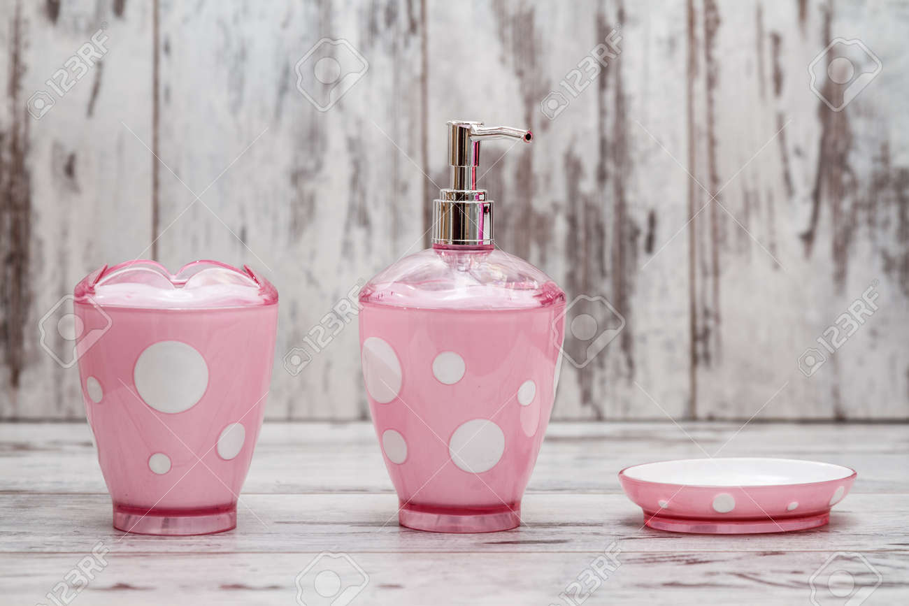 Set Of Cute Pink Bathroom Accessories On White Wooden Background Stock Photo Picture And Royalty Free Image Image 56142167