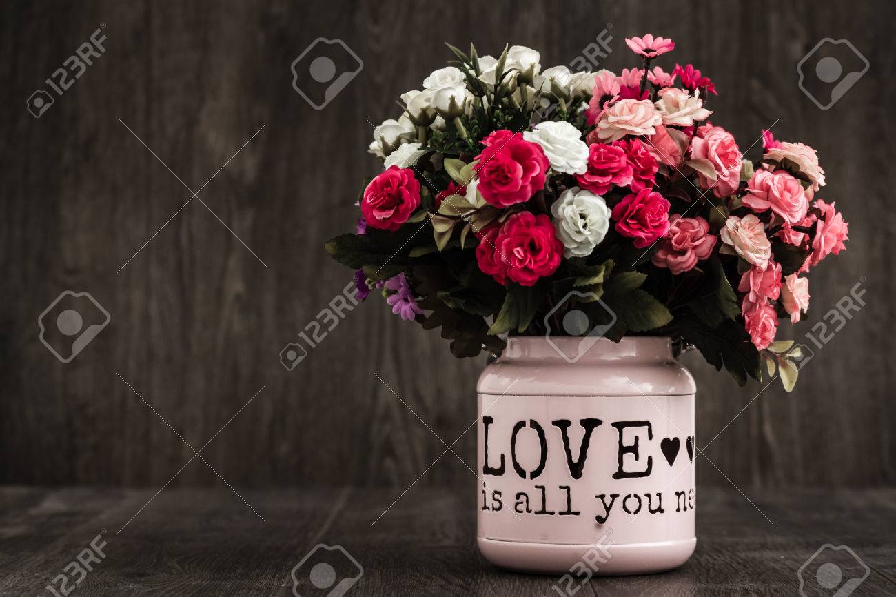 Artificial Colorful Flowers In A Pink Flower Vase Stock Photo