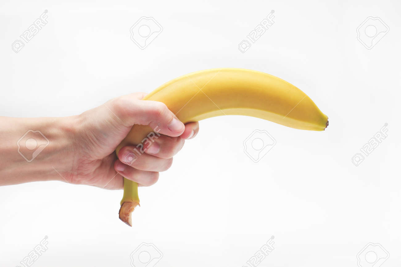 Banana Fruit Gun Hold In Caucasian White Male Hand Over White Background.  Stock Photo, Picture and Royalty Free Image. Image 56571983.