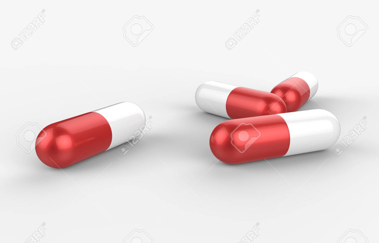 red and white pill capsules isolated on white background stock photo