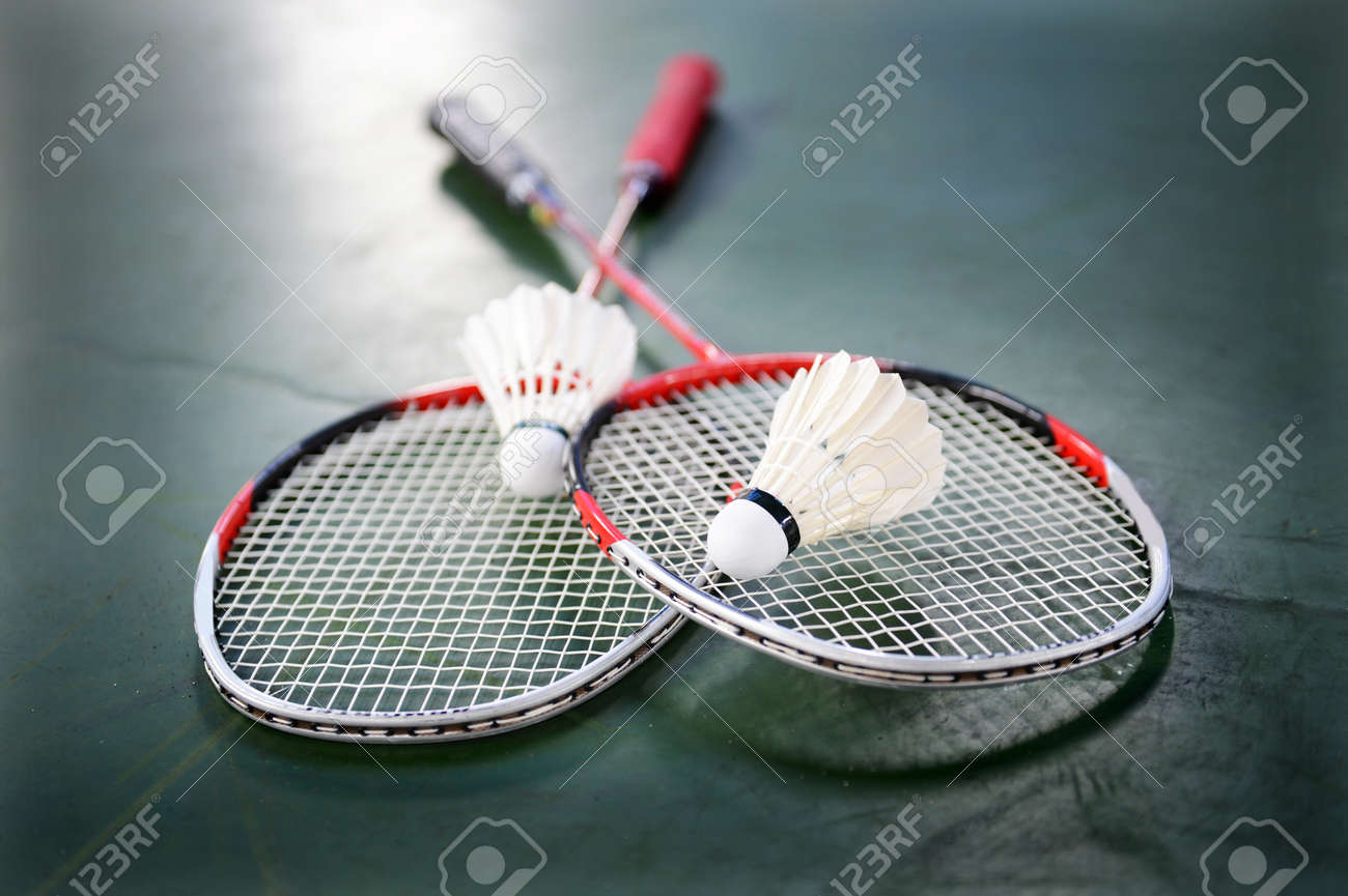 two shuttlecocks and badminton racket stock photo picture and