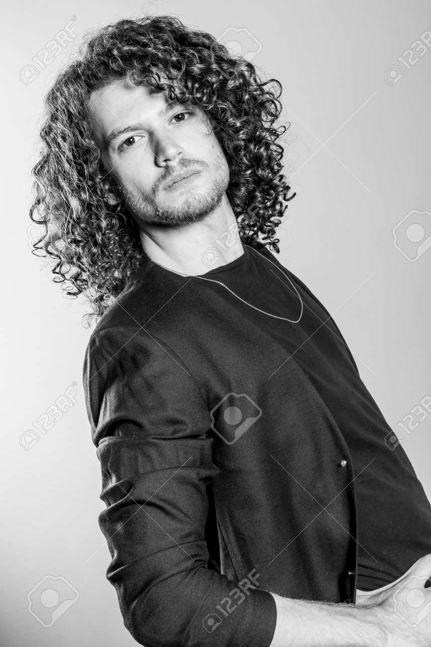 Attractive Young Man With Long Ginger Curly Hair In Black Blazer
