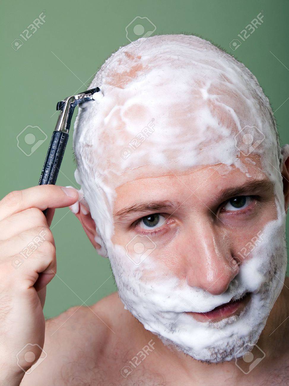 cutting hair with shaving razor