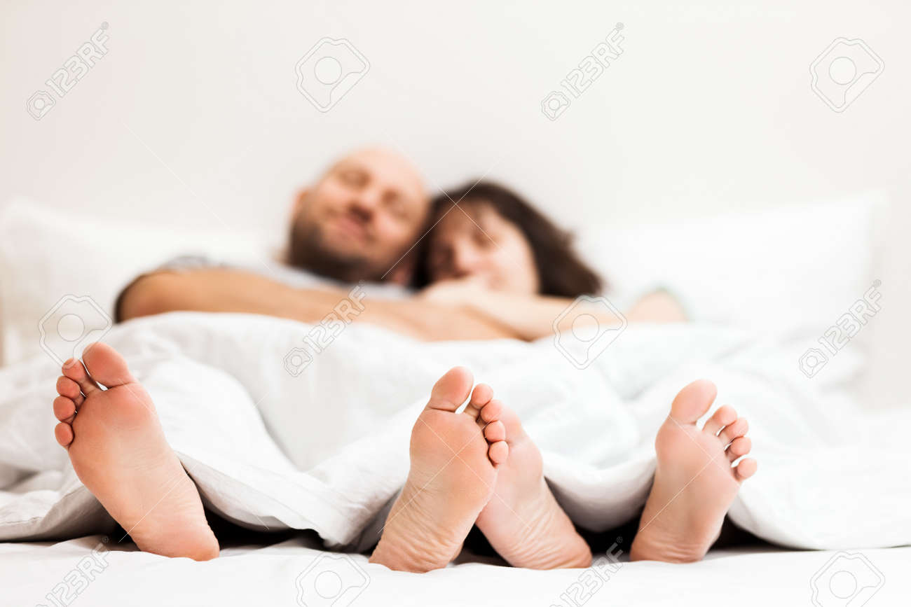 Love, Dating, Romantic Mood, Happy People And Bedtime Concept - Attractive  Caucasian Couple In Relationship Lying And Hugging On Bed In Bedroom Stock  Photo, Picture and Royalty Free Image. Image 134769165., image size:1300x867