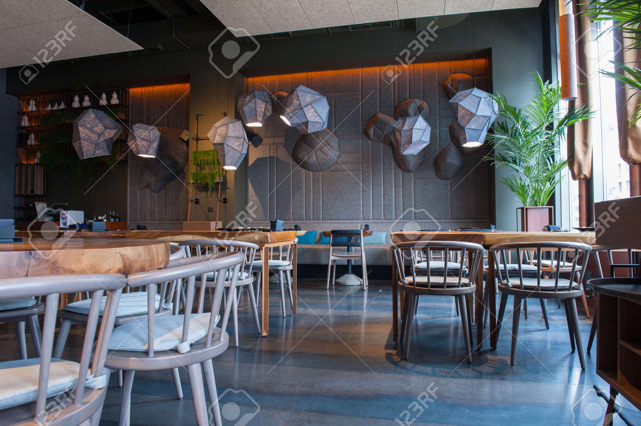 Modern design of interior in a restaurant. Elegant tables with chairs create pleasant atmosphere - 57290068 Modern design of interior in a restaurant. Elegant tables with chairs create pleasant atmosphere - 57290068