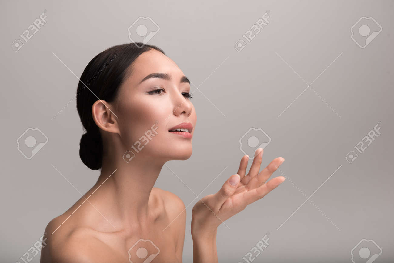 young asian girl on all four naked Elegant Beauty. Charming Naked Young Asian Girl Is Standing And Holding Her  Palm Up While Looking Ahead With Slight Smile And Tenderness. Isolated  Background And Copy Space In Right Side Stock Photo,