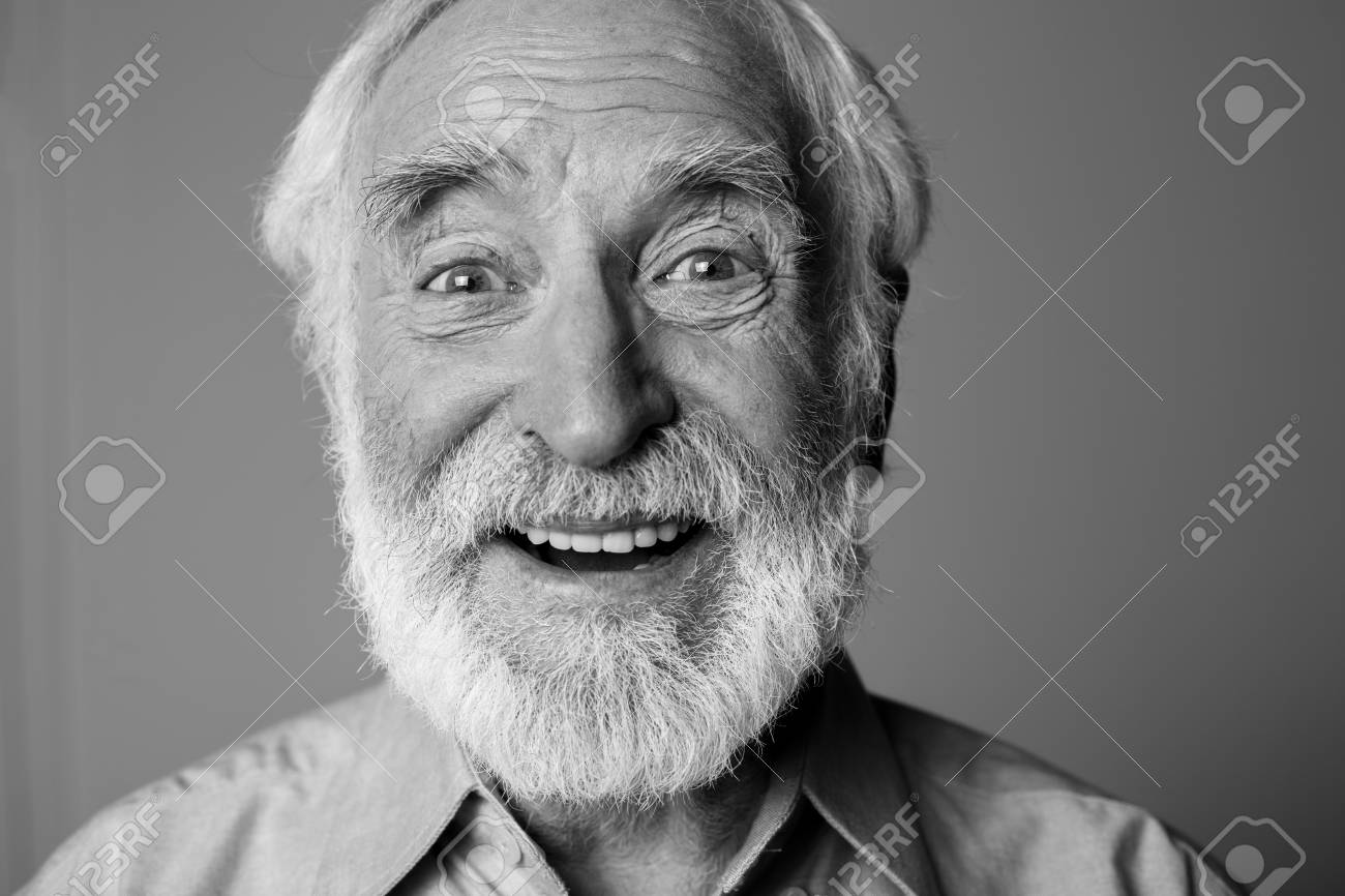 Sincere amazement. Close up black-and-white portrait of aged happy pensioner with widely open eyes while standing. Isolated on grey background - 91857666 Sincere amazement. Close up black-and-white portrait of aged happy pensioner with widely open eyes while standing. Isolated on grey background - 91857666