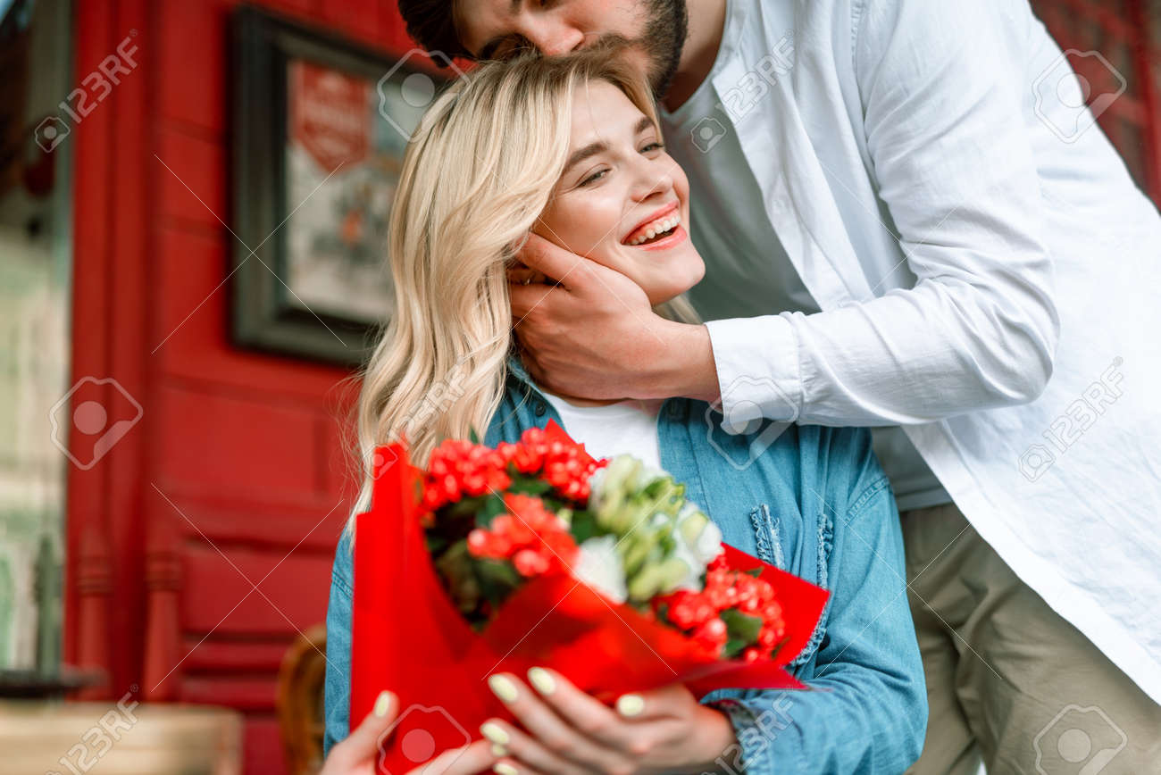 Smiling Lady Near Boyfriend After Getting Flowers From Him Stock Photo Picture And Royalty Free Image Image 126483682